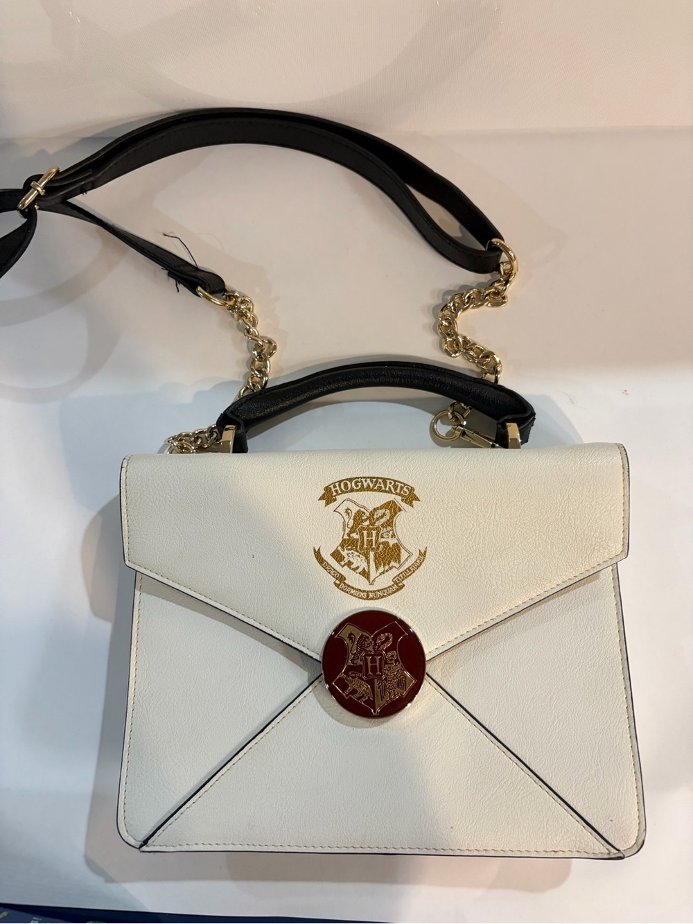 Harry Potter Wizarding World White Satchel with Gold Crest and Red Seal Accent